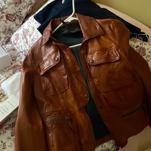 Gorgeous genuine leather jacket. Silk lining inside. Unique caramel color.